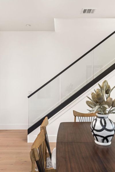 Stairway featuring wood finished floors and baseboards