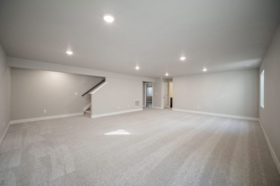 Spacious, unfurnished interior of a new home in The Glen, Colorado Springs (Image 29).