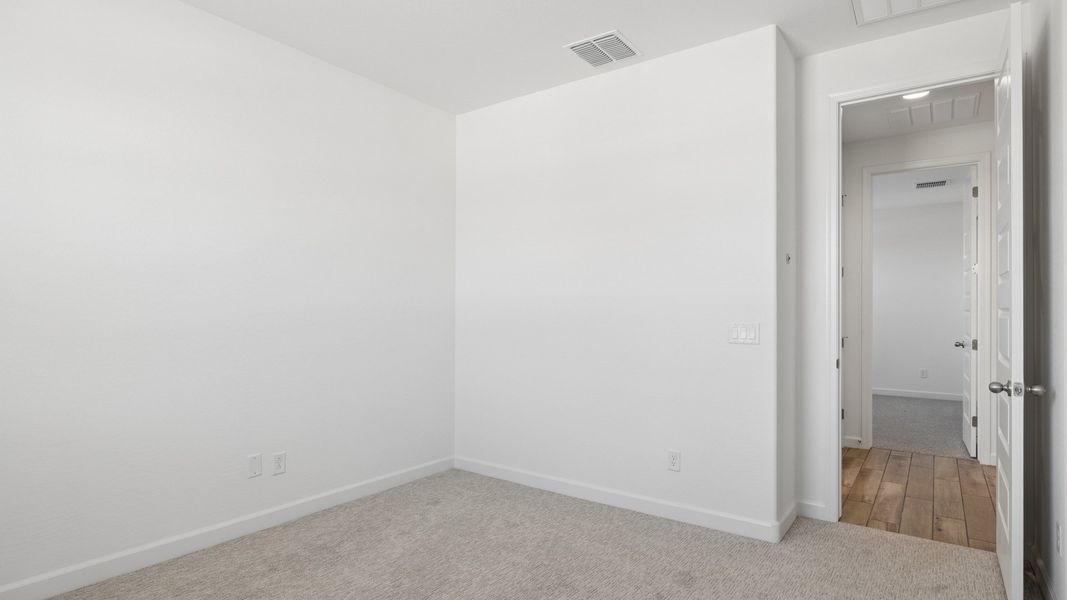 Spacious, unfurnished interior of a new home in Radiance at Superstition Vistas, Apache Junction (Image 30).