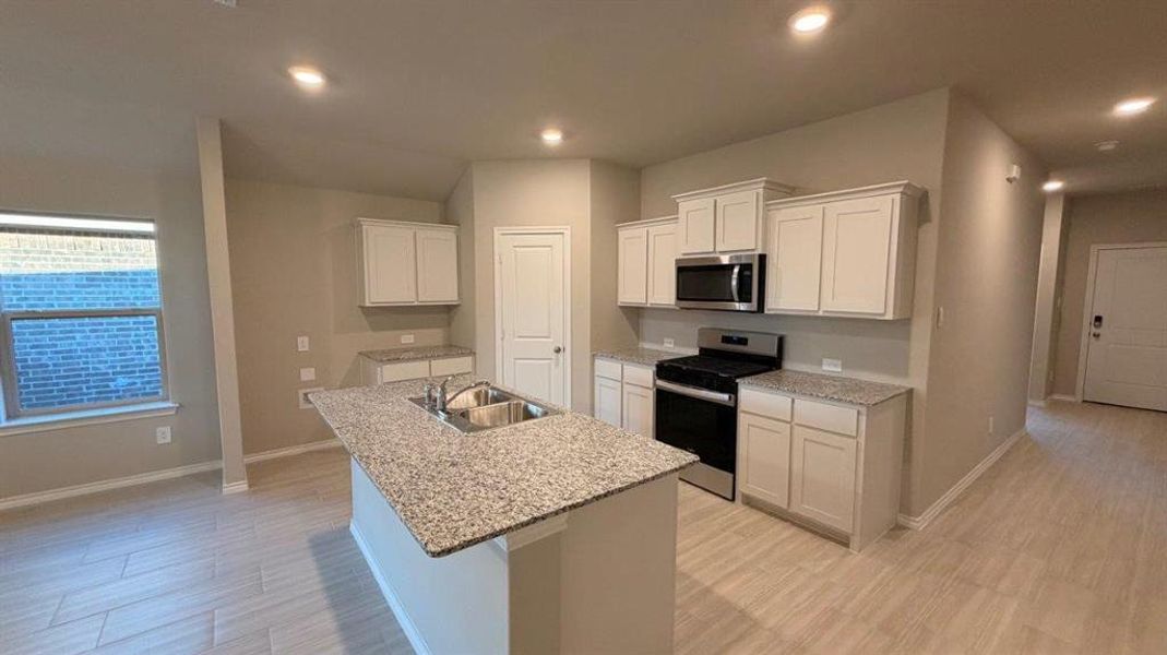 Kitchen- All Home and community information, including pricing, included features, terms, availability and amenities, are subject to change at any time without notice or obligation. All Drawings, pictures, photographs, video, square footages, floor plans, elevations, features, colors and sizes are approximate for illustration purposes only and will vary from the homes as built.