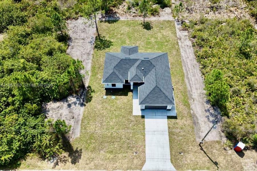 Front exterior of a new home in , Lehigh Acres, FL, highlighting curb appeal (Image 18).
