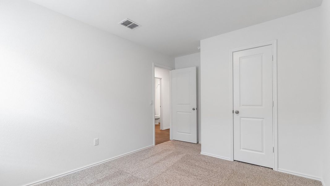 Representative unfurnished interior of a home built from the The Juniper by D.R. Horton in Palomino, Manor (Image 22).