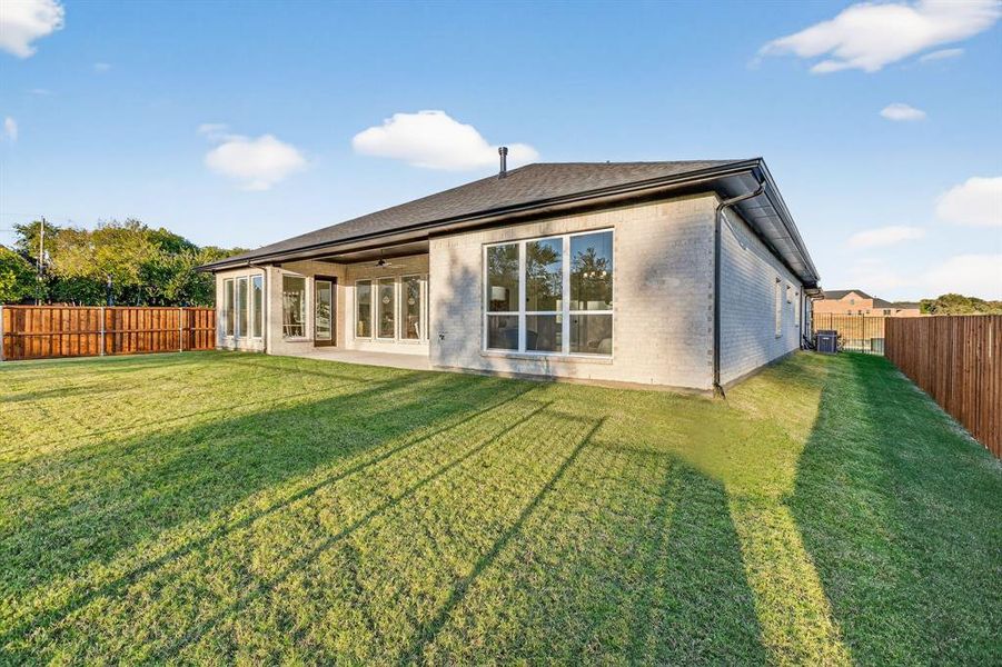 Exterior details and patio area of a home in The Grove, Fort Worth (Image 24).