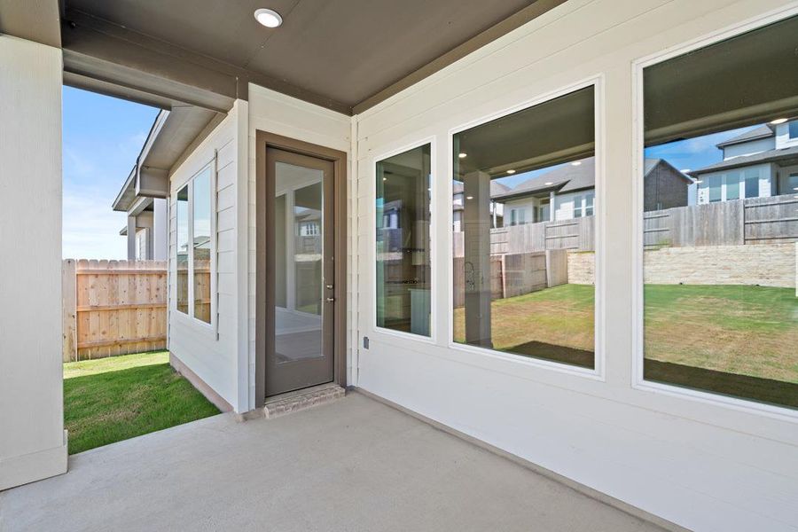 Exterior details and patio area of a home in Lariat, Liberty Hill (Image 23).