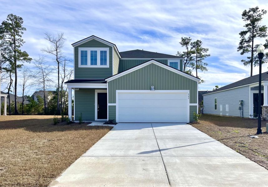 Front exterior of a new home in Lindera Preserve at Cane Bay Plantation, Summerville, SC, highlighting curb appeal (Image 1). Front exterior of a new home in Lindera Preserve at Cane Bay Plantation, Summerville, SC, highlighting curb appeal (Image 1).