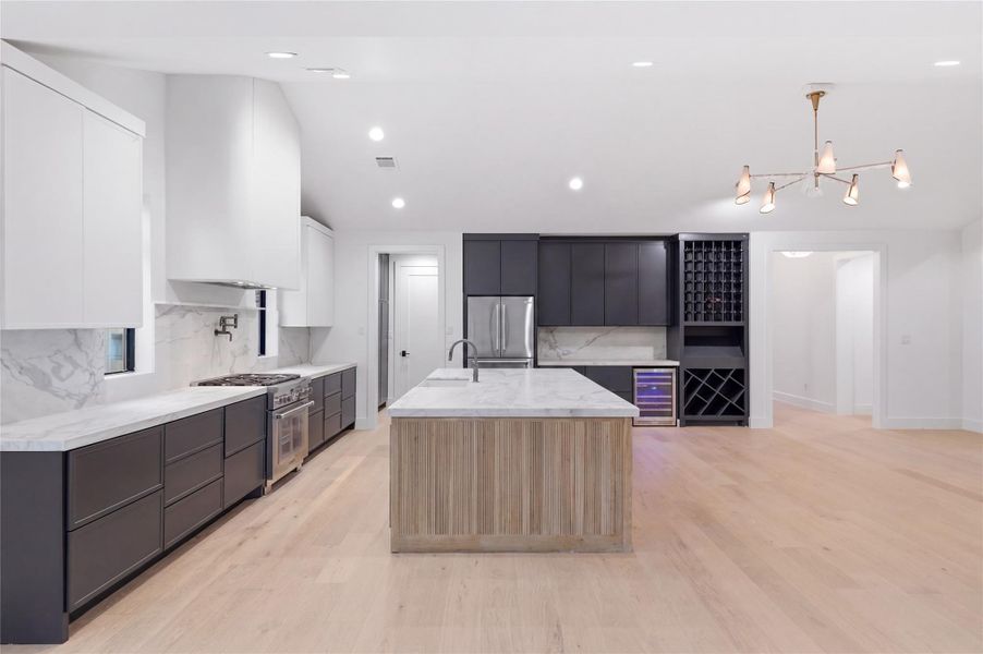 The spacious dining area flows seamlessly into the kitchen and living room, enhancing the home’s bright and connected open-concept design.