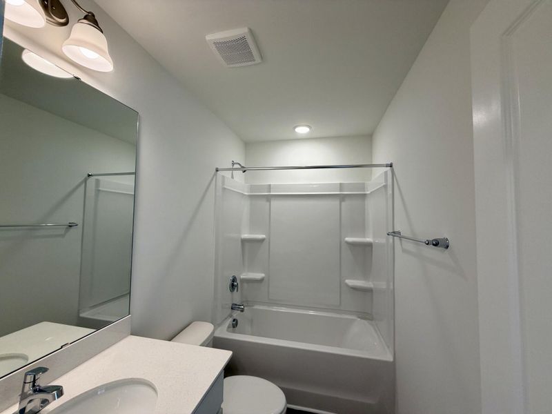 Furnished interior view inside a new home in Bellevue Townhomes, Greenville (Image 6).
