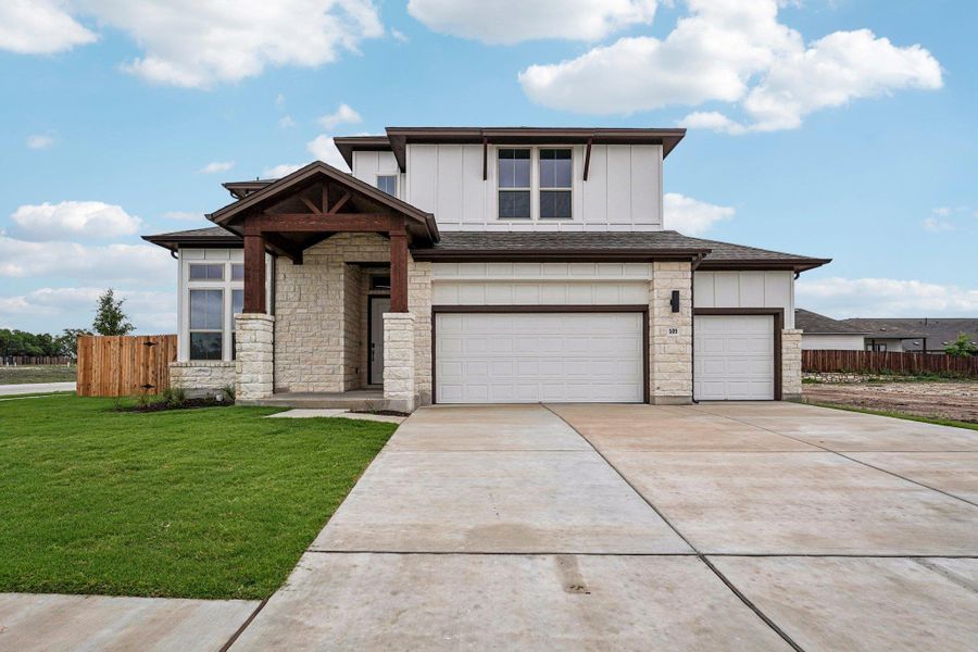 Front exterior of a new home in Sage Hollow, Kyle, TX, highlighting curb appeal (Image 1). Front exterior of a new home in Sage Hollow, Kyle, TX, highlighting curb appeal (Image 1).
