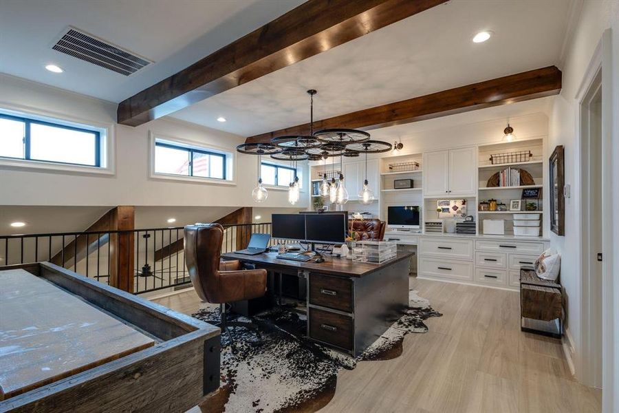 Home office featuring beam ceiling, light hardwood / wood-style floors, and a chandelier Home office featuring beam ceiling, light hardwood / wood-style floors, and a chandelier