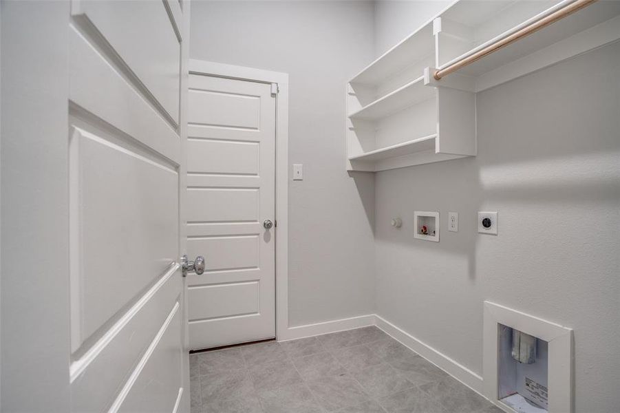 Laundry room with electric dryer hookup, hookup for a gas dryer, and hookup for a washing machine