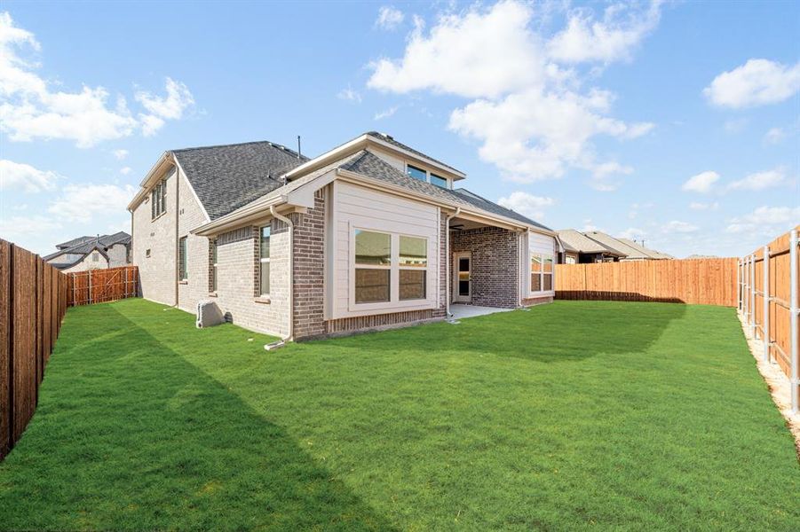Exterior details and patio area of a home in Country Lakes, Denton (Image 27).