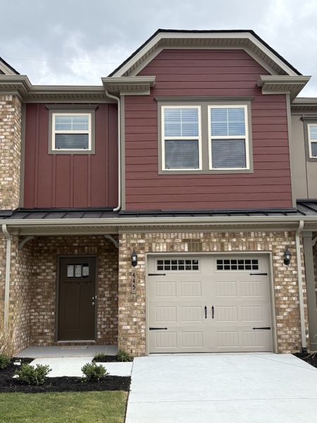 Front exterior of a new home in Talia Trace, Smyrna, TN, highlighting curb appeal (Image 1). Front exterior of a new home in Talia Trace, Smyrna, TN, highlighting curb appeal (Image 1).