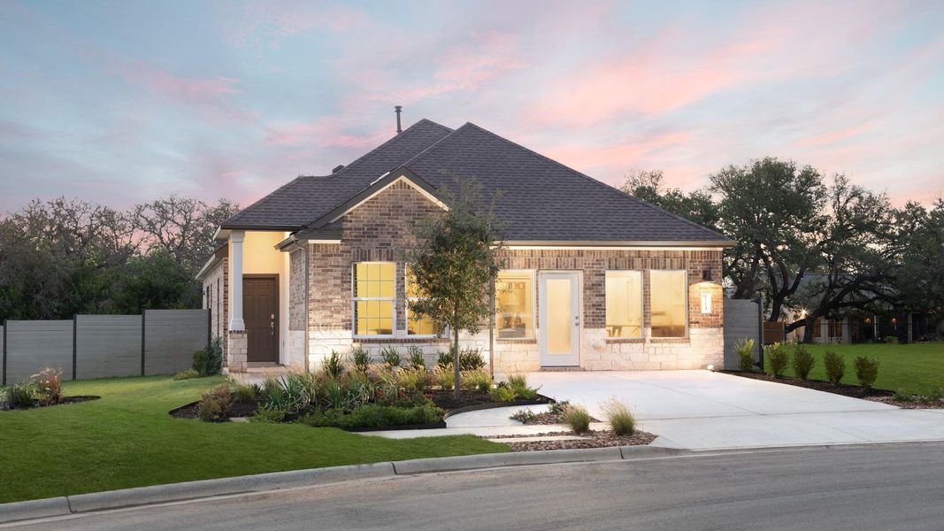 Front exterior of a new home in The Colony: Ridgepointe and Claremont Collections, Bastrop, TX, highlighting curb appeal (Image 15).
