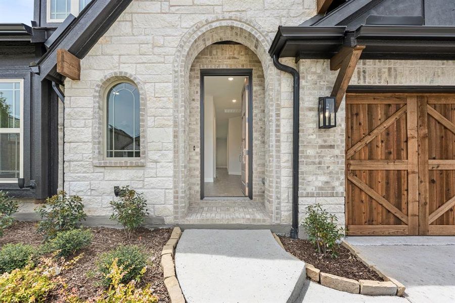 Front exterior of a new home in Painted Tree Woodland District 50, McKinney, TX, highlighting curb appeal (Image 23). Front exterior of a new home in Painted Tree Woodland District 50, McKinney, TX, highlighting curb appeal (Image 23).