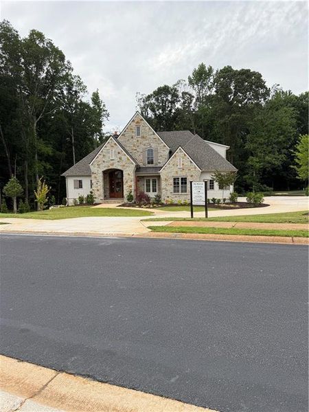 Front exterior of a new home in , Flowery Branch, GA, highlighting curb appeal (Image 8).
