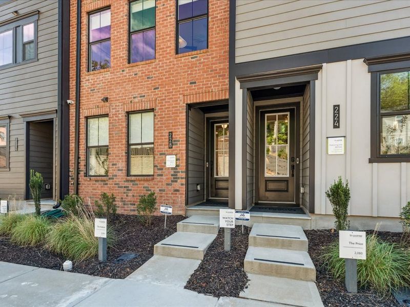 Front exterior of a new home in Old Town Village, Waxhaw, NC, highlighting curb appeal (Image 1). Front exterior of a new home in Old Town Village, Waxhaw, NC, highlighting curb appeal (Image 1).
