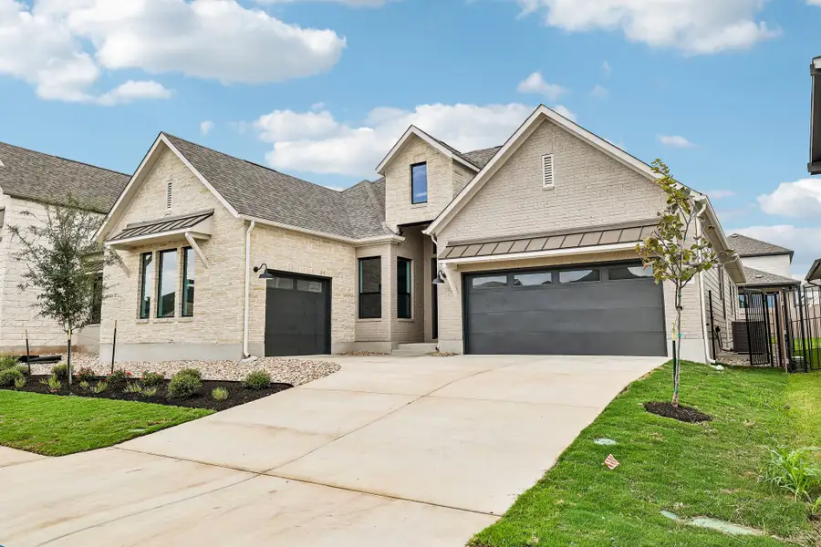 Front exterior of a new home in Easton Park, Austin, TX, highlighting curb appeal (Image 2). Front exterior of a new home in Easton Park, Austin, TX, highlighting curb appeal (Image 2).