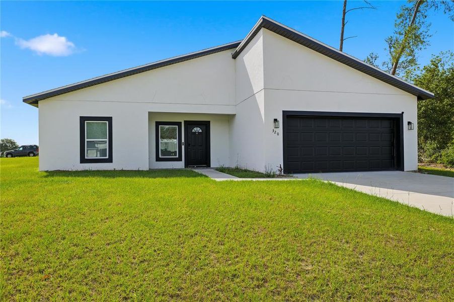 Front exterior of a new home in , Ocala, FL, highlighting curb appeal (Image 22).