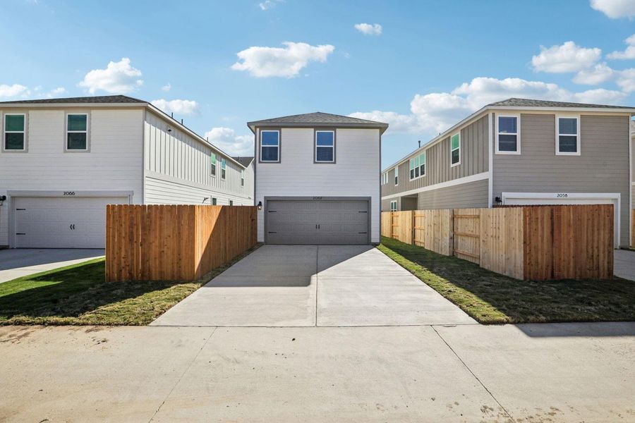 Front exterior of a new home in Avery Centre, Round Rock, TX, highlighting curb appeal (Image 20).