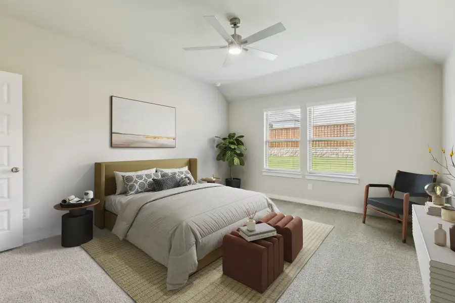 Primary bedroom in the Heisman home plan by Trophy Signature Homes – REPRESENTATIVE PHOTO