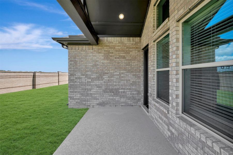 Exterior details and patio area of a home in Prairieland Village - Grove Collection, Cypress (Image 27). Exterior details and patio area of a home in Prairieland Village - Grove Collection, Cypress (Image 27).