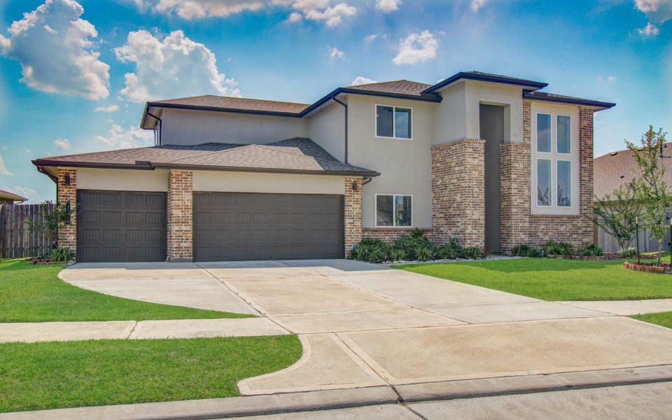 Front exterior of a new home in Parks Edge, Missouri City, TX, highlighting curb appeal (Image 2).
