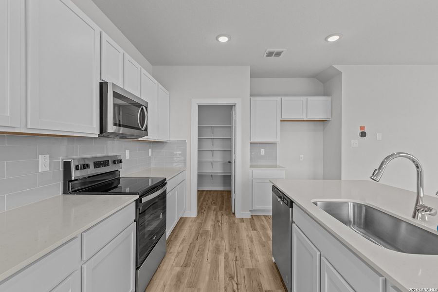 Furnished interior view inside a new home in Spring Creek, San Antonio (Image 7).