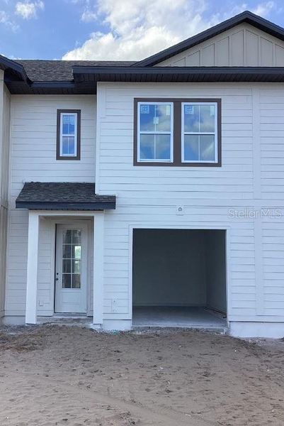 Front exterior of a home in the The Enclaves at Festival Cove community, located in Davenport, FL (Image 12).