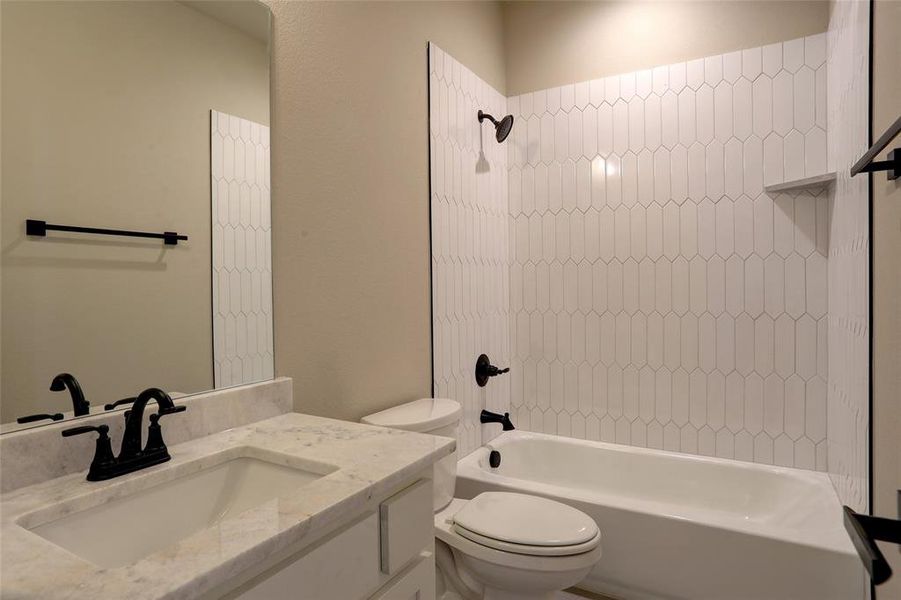 Full bathroom with shower / bath combination and vanity Full bathroom with shower / bath combination and vanity