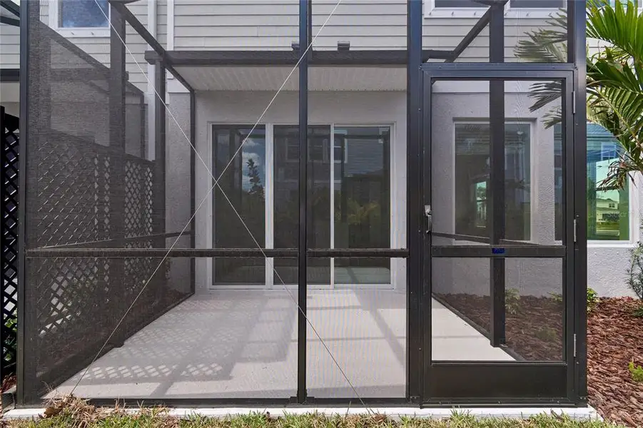 Exterior details and patio area of a home in North River Ranch – Townhomes, Parrish (Image 3).