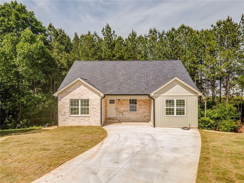 Front exterior of a new home in , Calhoun, GA, highlighting curb appeal (Image 24). Front exterior of a new home in , Calhoun, GA, highlighting curb appeal (Image 24).