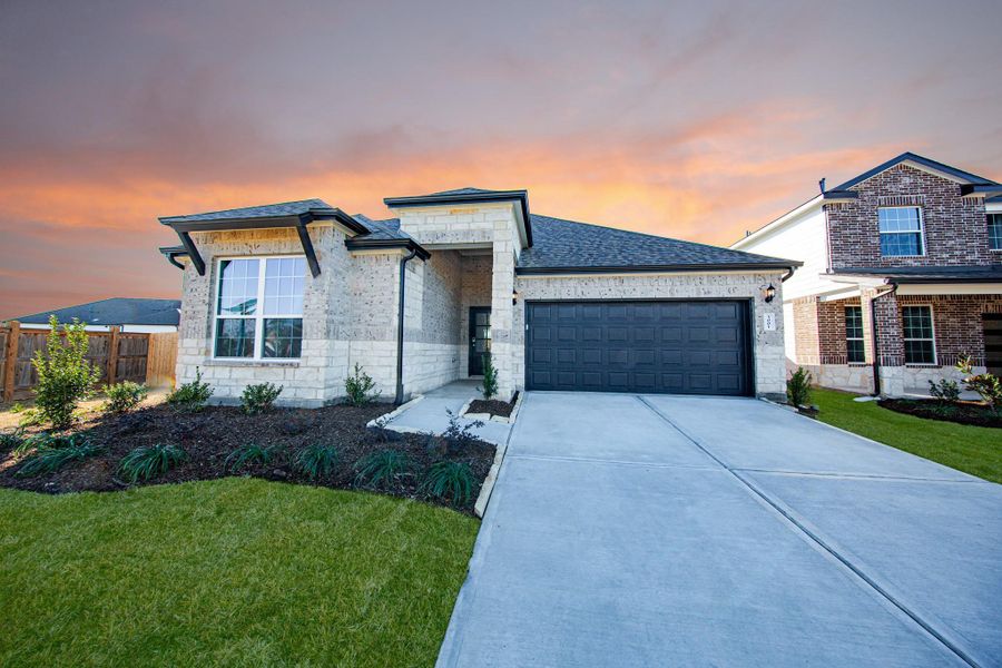 Front exterior of a new home in Bluestem, Brookshire, TX, highlighting curb appeal (Image 2). Front exterior of a new home in Bluestem, Brookshire, TX, highlighting curb appeal (Image 2).