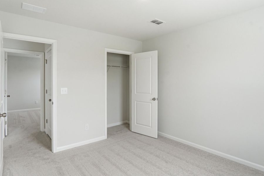 Spacious, unfurnished interior of a new home in Sanctuary Cove at Cane Bay, Summerville (Image 20).