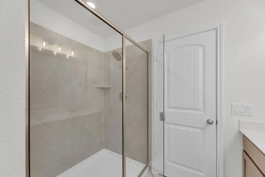 Furnished interior view inside a new home in Mustang Valley, Manor (Image 14).