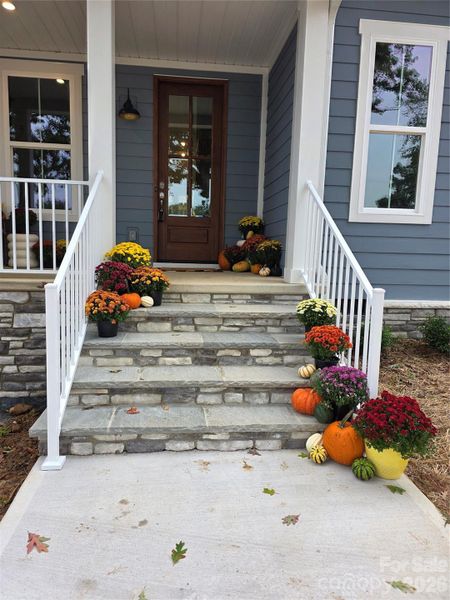 The front porch is an open canvas to add comfortable seating, a swing, and tasteful decorations, creating an inviting atmosphere. The front porch is an open canvas to add comfortable seating, a swing, and tasteful decorations, creating an inviting atmosphere.