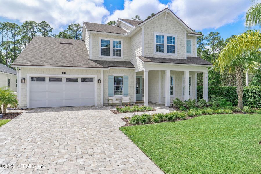 Front exterior of a new home in Palm Crest AT Seabrook, Ponte Vedra, FL, highlighting curb appeal (Image 24).
