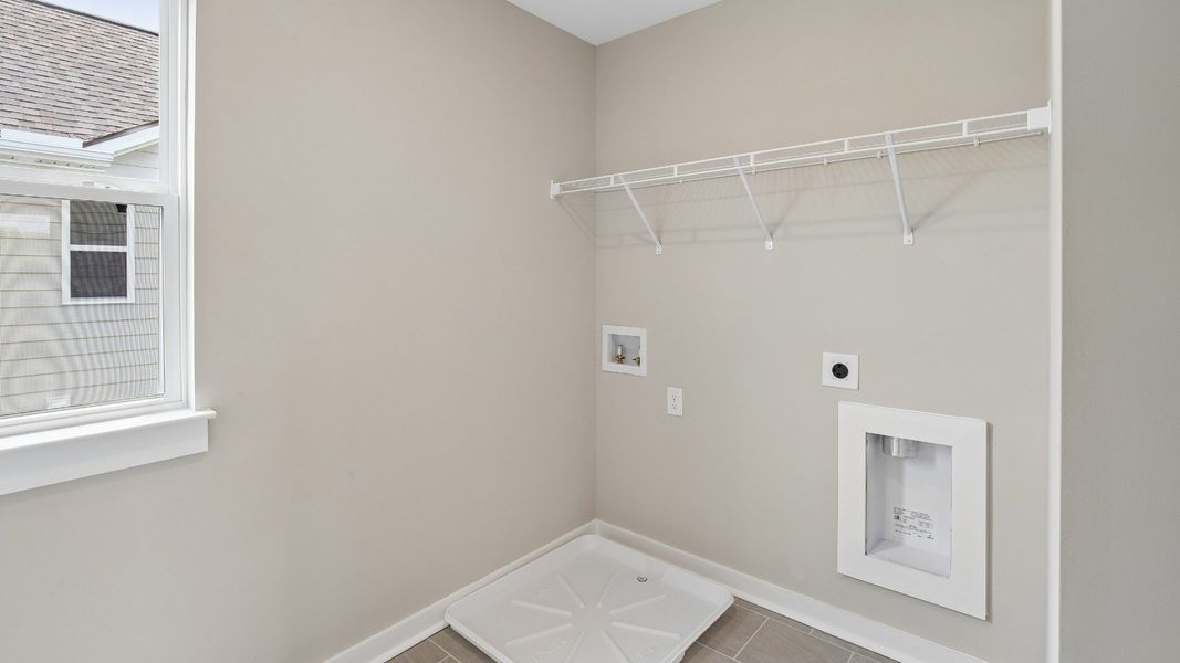 Dedicated Laundry Room with Shelving