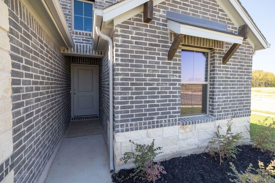 Exterior details and patio area of a home in Trinity Ranch, Elgin (Image 3).