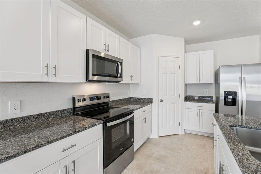 Furnished interior view inside a new home in Lawson Dunes - Signature Series, Haines City (Image 14).