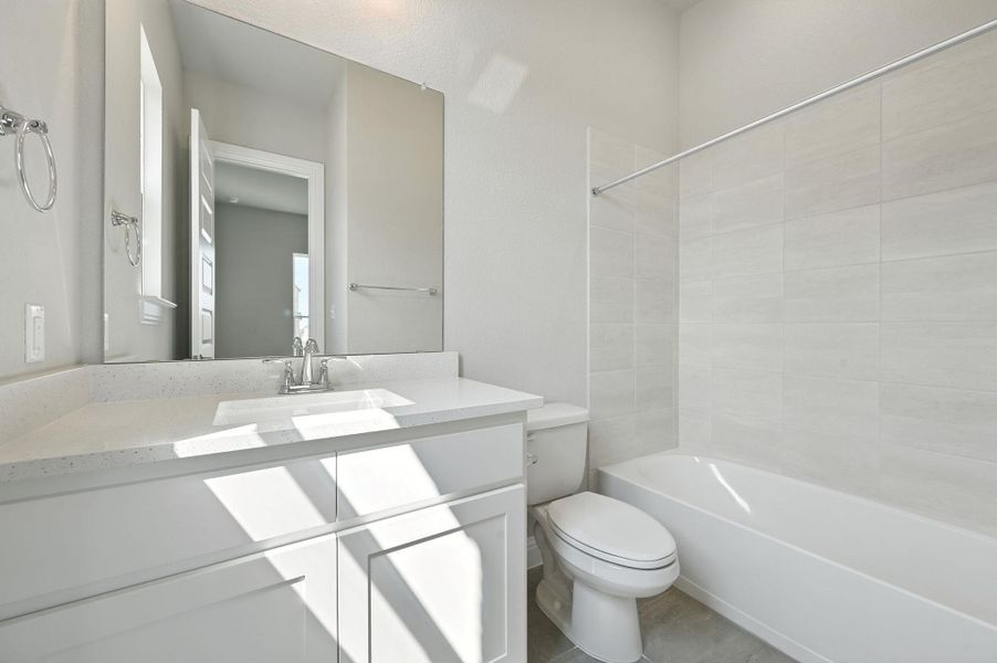 Full bathroom featuring vanity and shower / bath combination