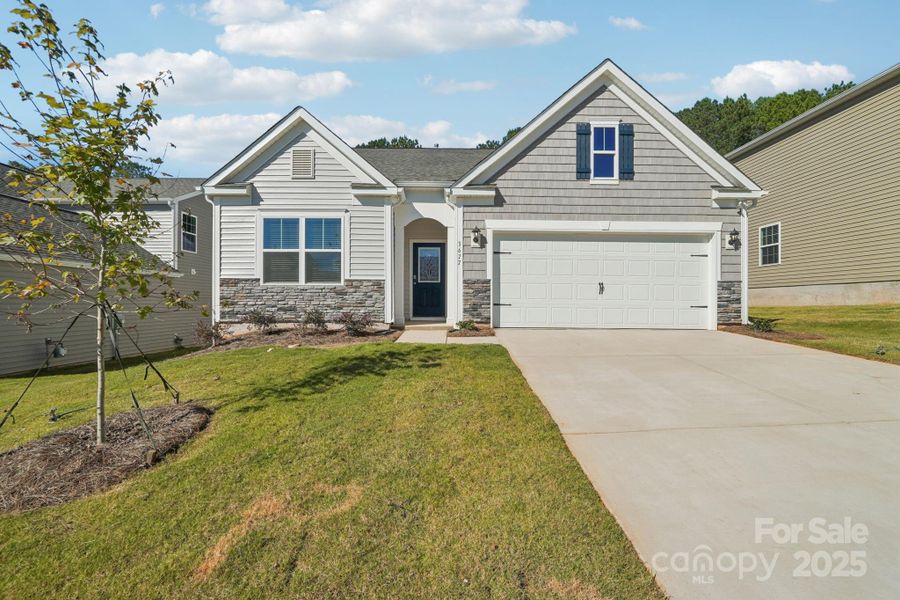 Front exterior of a new home in Cline Village, Conover, NC, highlighting curb appeal (Image 1). Front exterior of a new home in Cline Village, Conover, NC, highlighting curb appeal (Image 1).