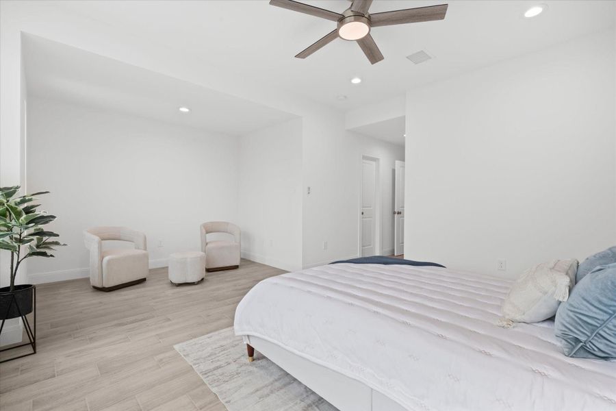 Master bedroom with a sitting area