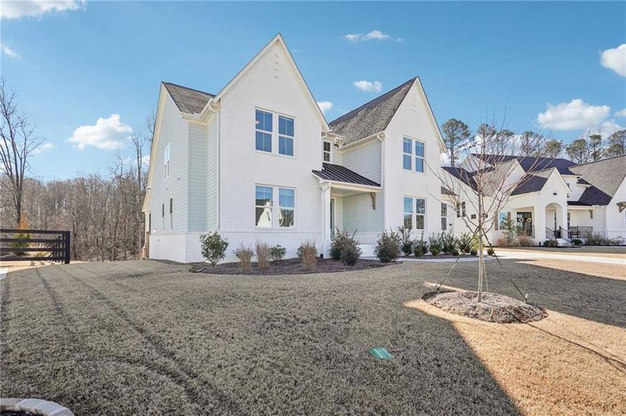Front exterior of a new home in Fireside Farms, Dawsonville, GA, highlighting curb appeal (Image 26).