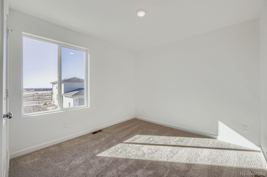 Spacious, unfurnished interior of a new home in Percheron: The Explorer Collection, Colorado Springs (Image 7).