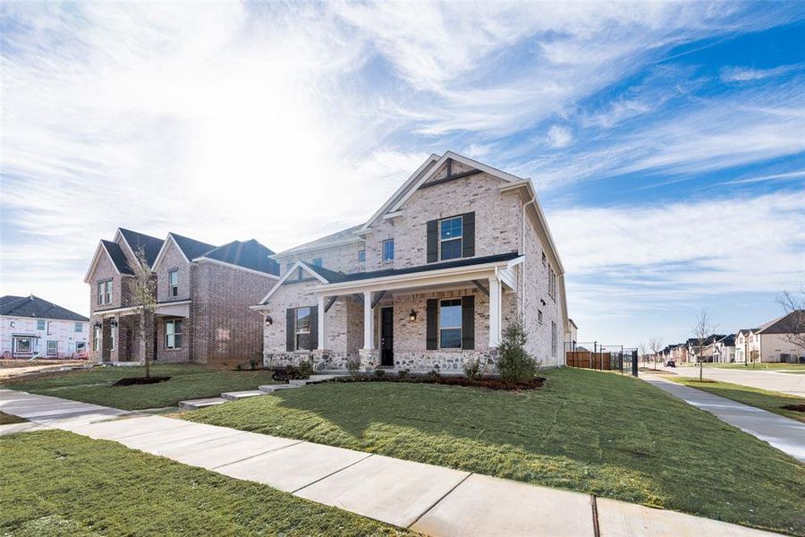 Front exterior of a new home in Villages of Creekwood, Frisco, TX, highlighting curb appeal (Image 22).