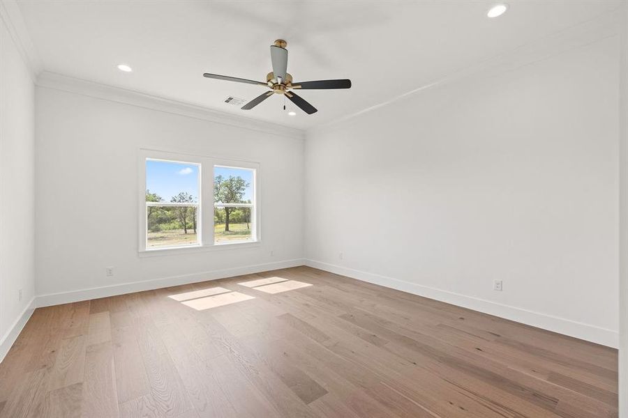 Gameroom featuring recessed lighting, visible vents, baseboards, and ornamental molding