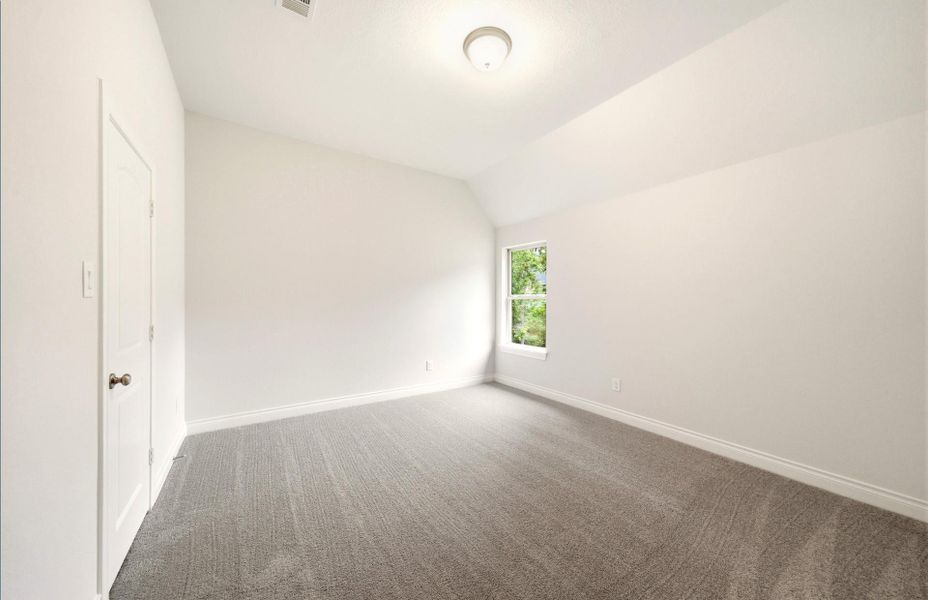 Spacious, unfurnished interior of a new home in The Woodlands Hills 65′, Willis (Image 28).