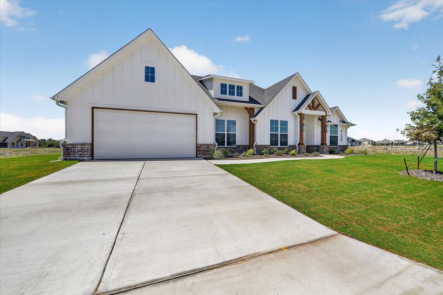 Front exterior of a new home in Paloma Ranches, Justin, TX, highlighting curb appeal (Image 23). Front exterior of a new home in Paloma Ranches, Justin, TX, highlighting curb appeal (Image 23).
