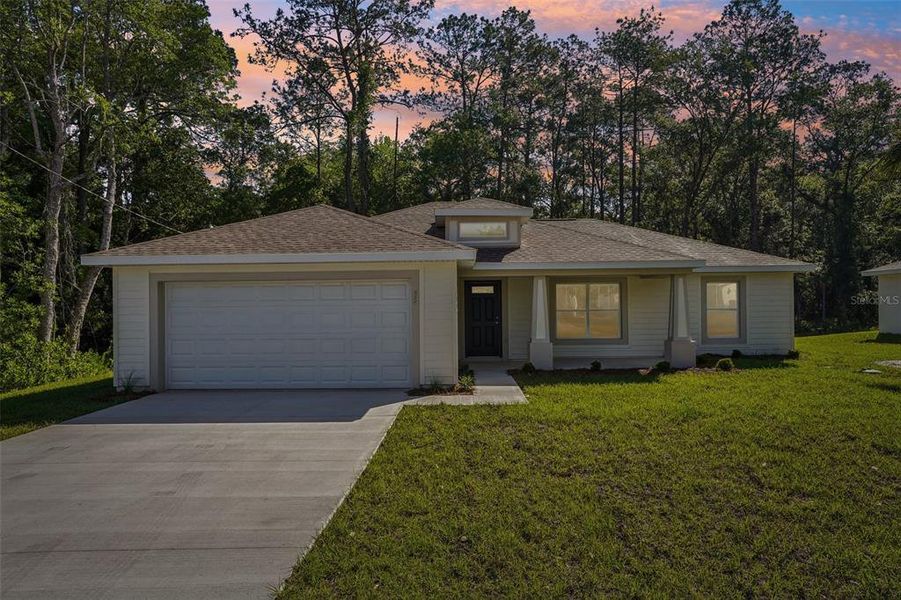 Front exterior of a new home in , Ocala, FL, highlighting curb appeal (Image 21).
