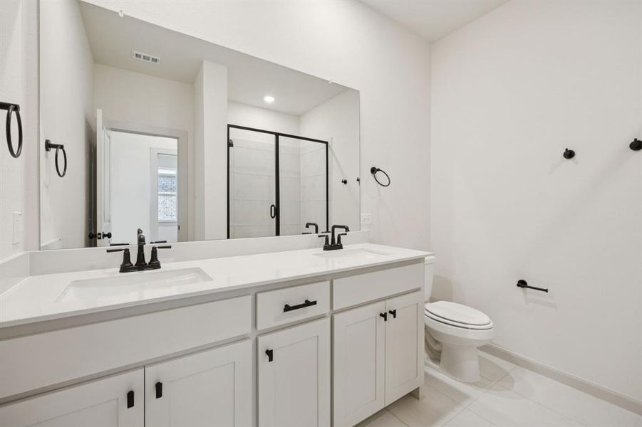 Friends and family will feel right at home in either of the beautifully finished guest baths in our Giselle plan.